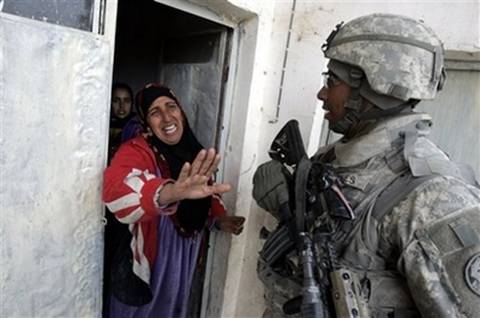 A woman cries as she talks to a U.S. army soldier from Ghostrider ...